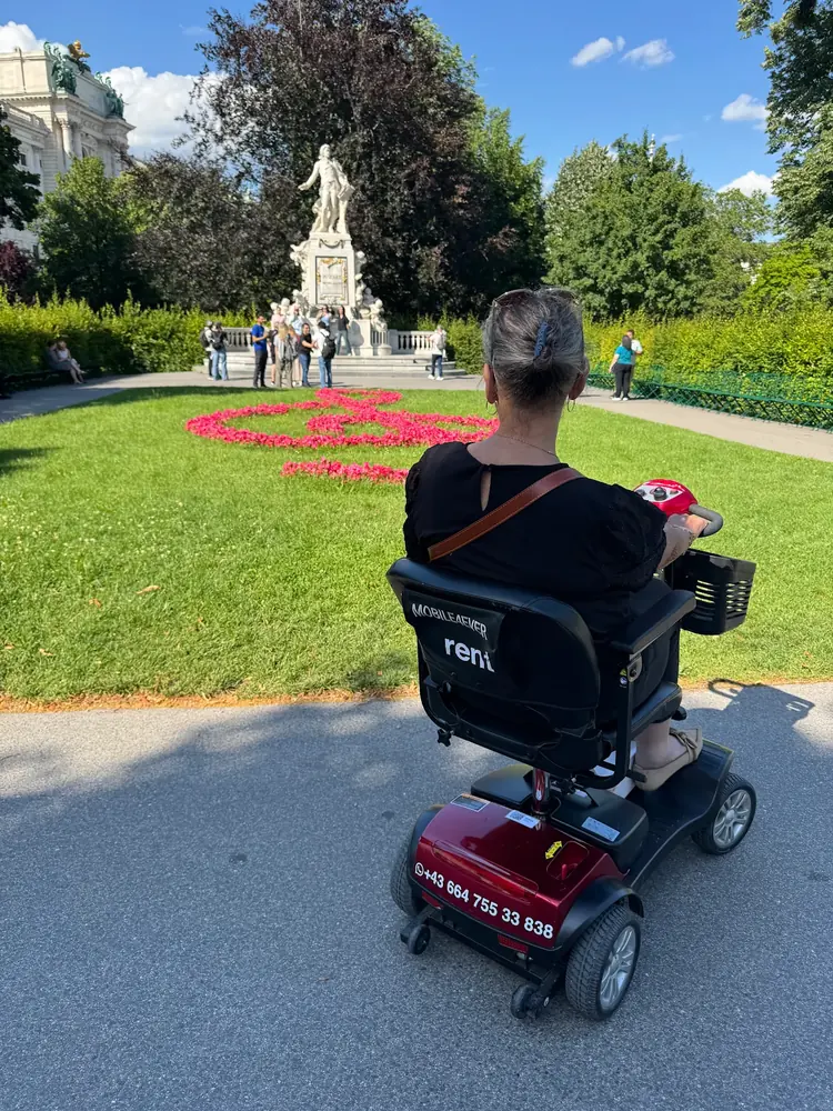 Mobile4Ever customer on a mobility scooter at Mozart Monument, Vienna